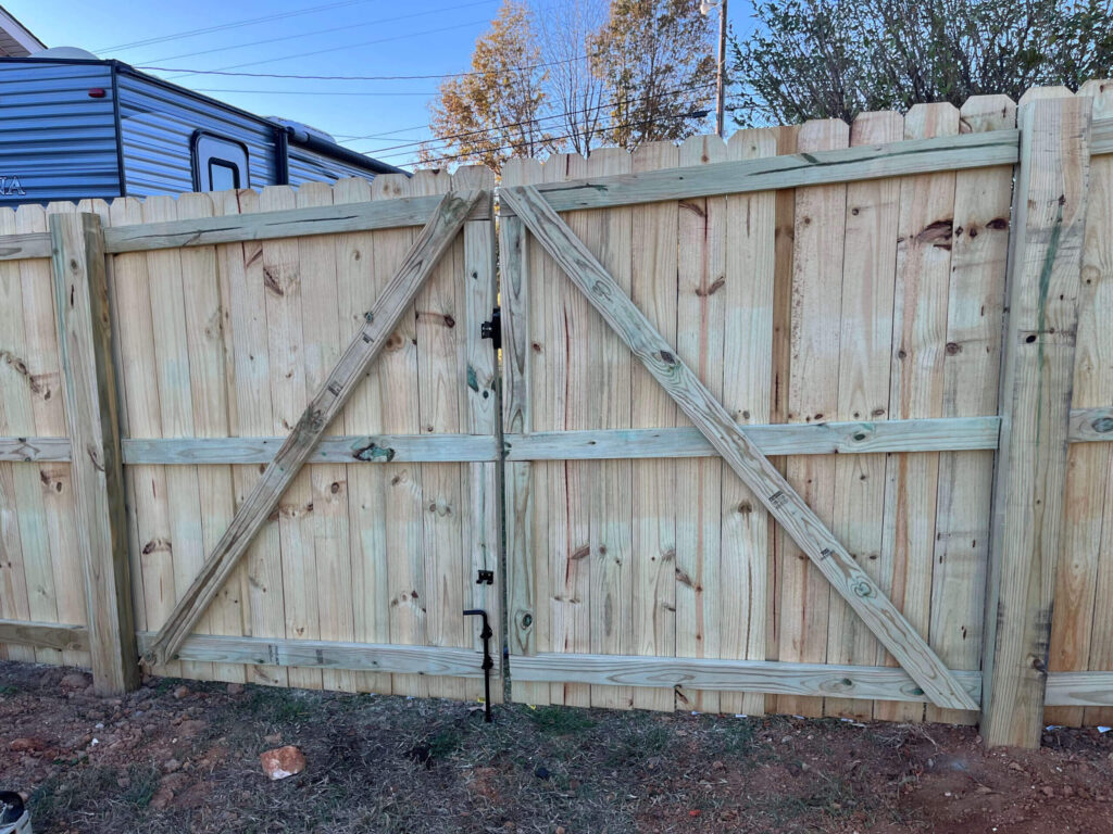 Wood Fence Gate Installation by TM Exterior Solutions