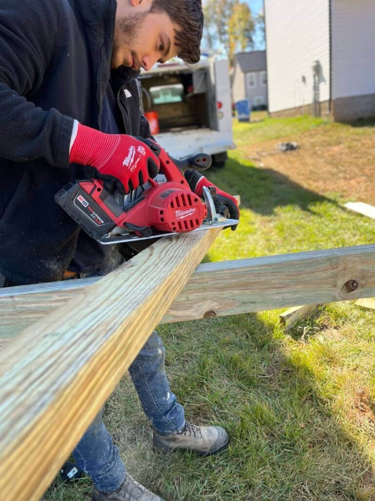 TM Exterior Expert Doing Fence Repair Service